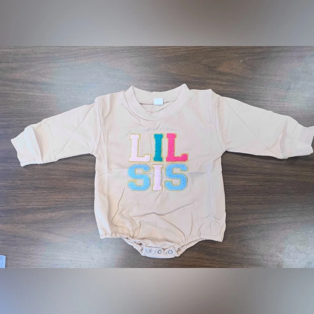 Lil Sis Baby Onesie in Cream with Colorful Letters. Size 3-6 months